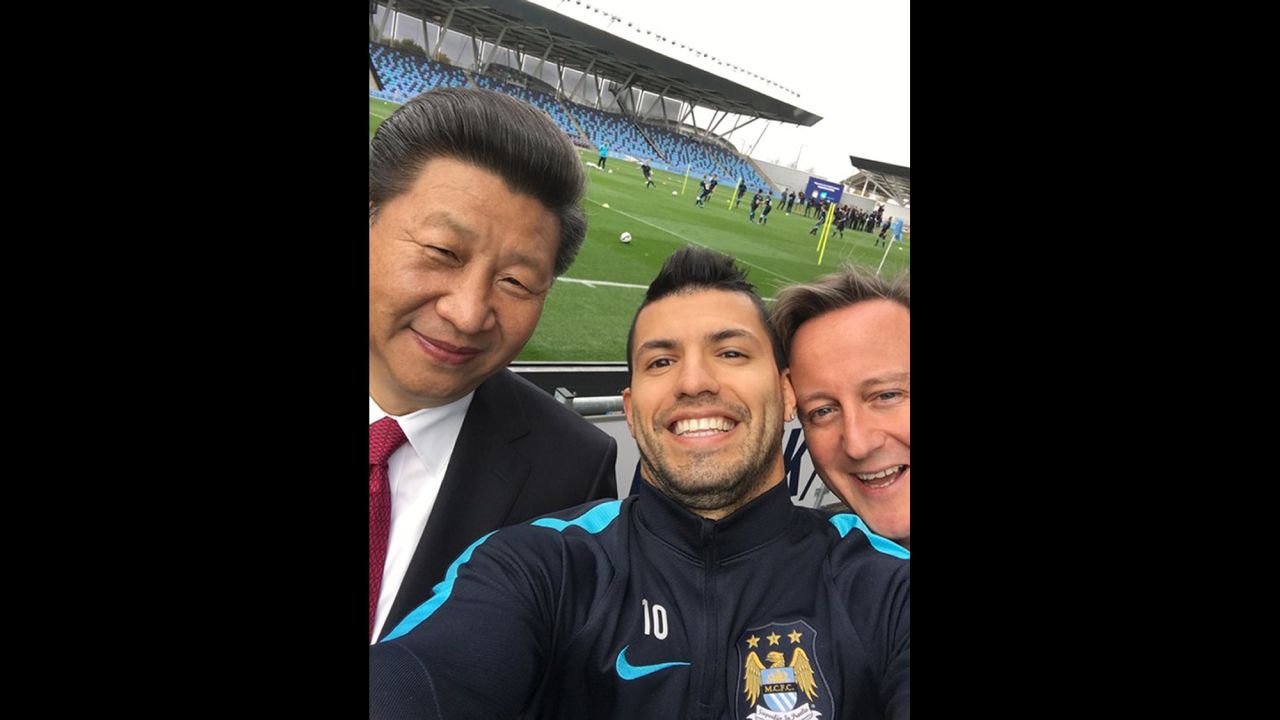 Soccer player Sergio Aguero takes a selfie with Britain's Prime Minister David Cameron, right, and Chinese President Xi Jinping in Manchester, England, on Friday, October 23.