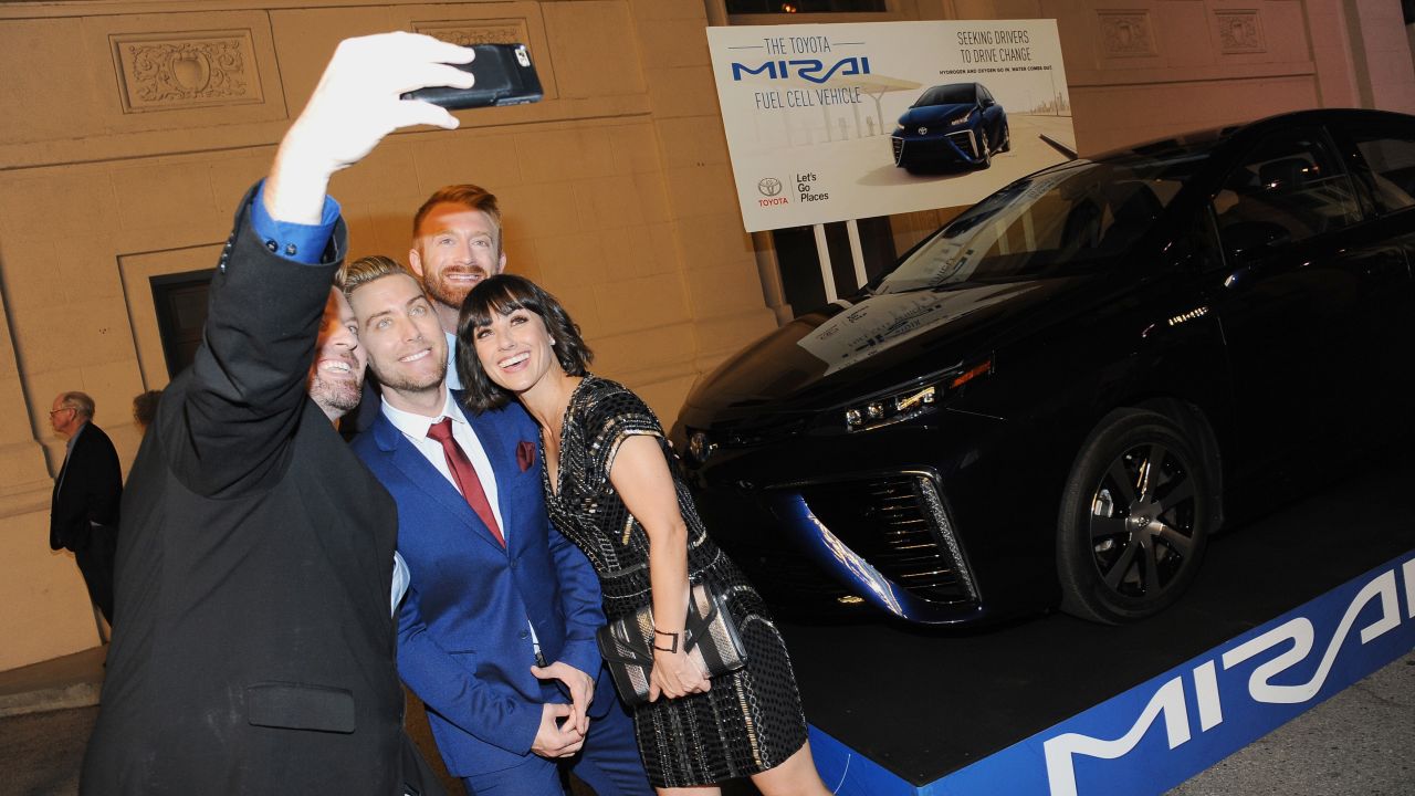 Host Lance Bass, center, and actress Constance Zimmer, right, pose for a selfie at the 25th annual Environmental Media Association Awards in Burbank, California, on Saturday, October 24.