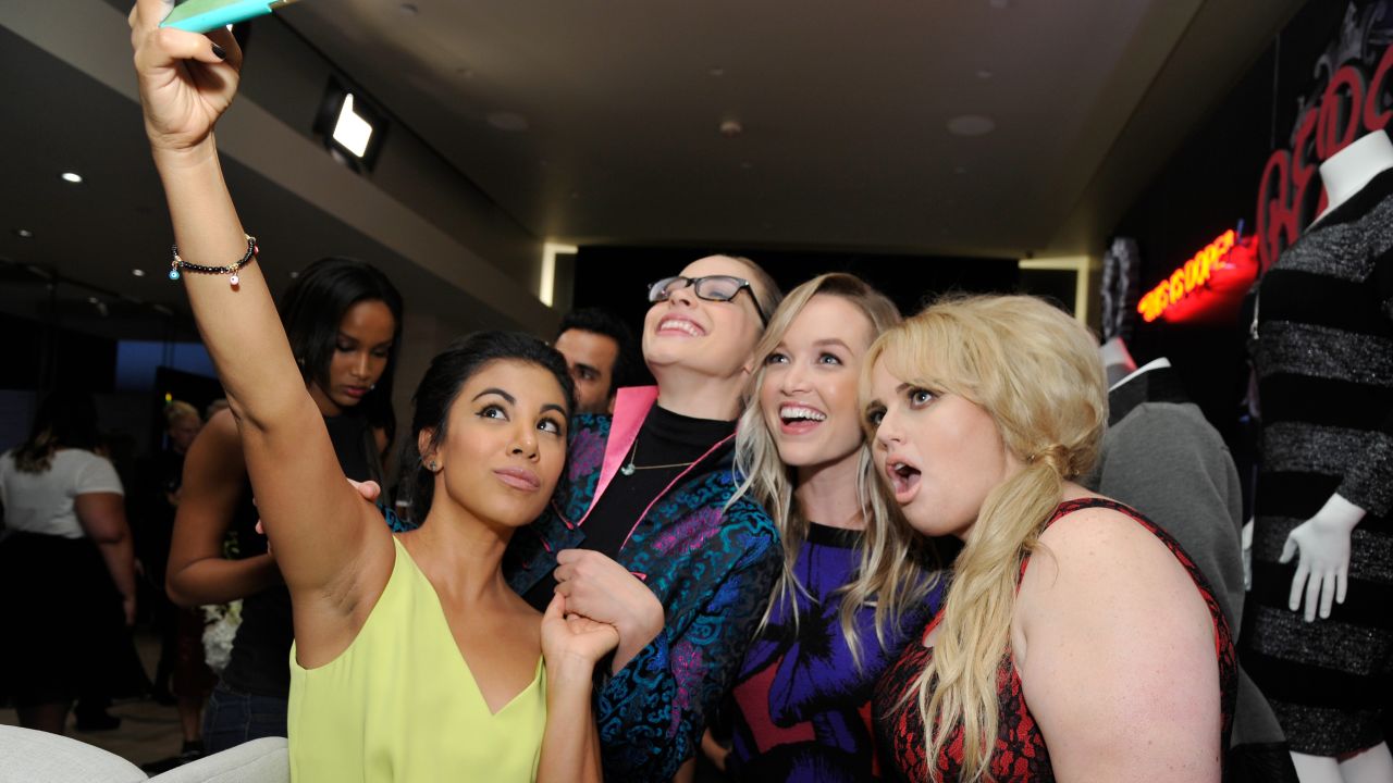 From left, actresses Chrissie Fit, Alexis Knapp, Kelley Jakle and Rebel Wilson take a selfie at the Rebel Wilson for Torrid launch at Milk Studios in Los Angeles on Thursday, October 22.