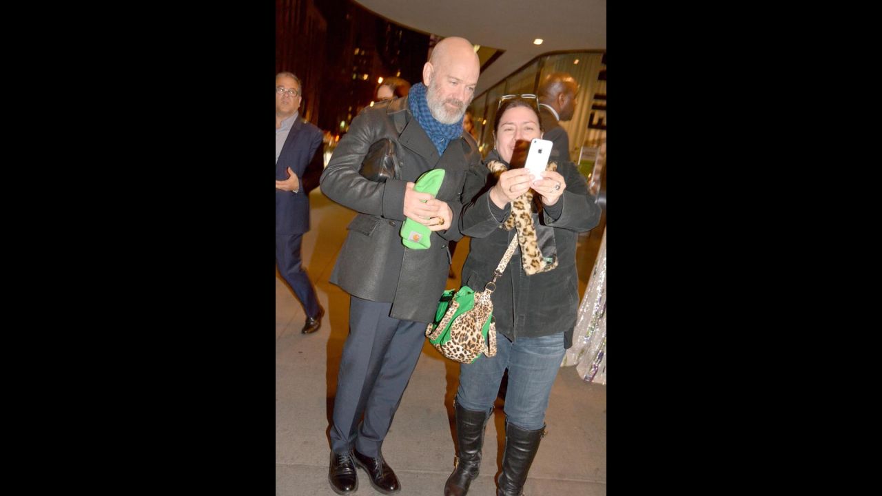 R.E.M. singer Michael Stipe poses for  selfie with a fan outside the "Miss You Already" screening at the Museum of Modern Art in New York on Sunday, October 25.