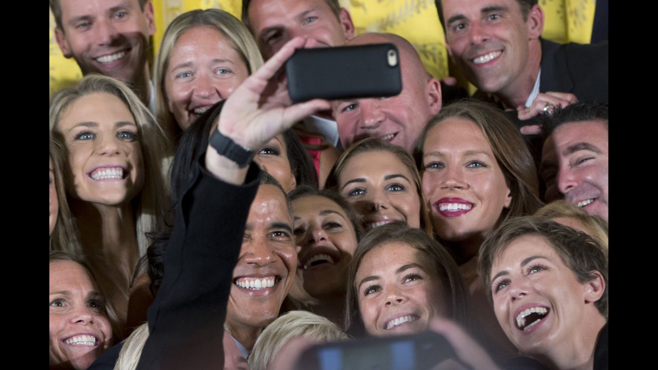 President Barack Obama poses for a selfie with members of the U.S. Women's National Soccer Team during an event honoring the world champion team at the White House on Tuesday, October 27.