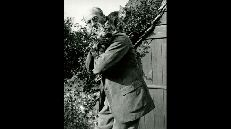 Children's book illustrator Arthur Rackham, famed for his pen-and-ink drawings, was known to make room for cats in his books -- he created a Cheshire Cat for "Alice's Adventures in Wonderland" -- and on his shoulders.<br /> 