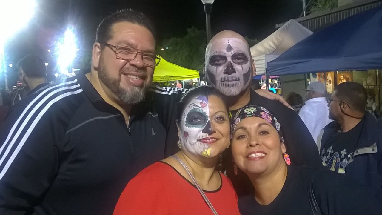 Valerie Vela, her husband and friends participated in their local festival by painting their faces