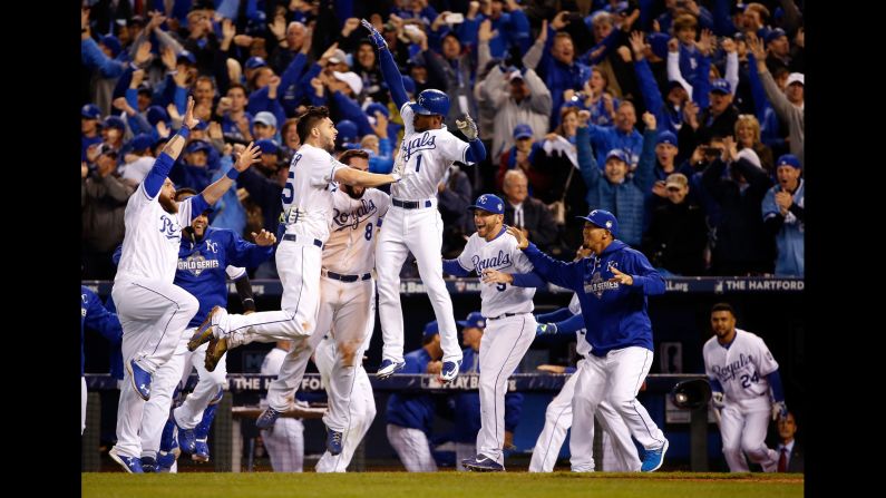 The Kansas City Royals celebrate their 5-4 win against the New York Mets after 14 innings in<a href="index.php?page=&url=http%3A%2F%2Fwww.cnn.com%2F2015%2F10%2F27%2Fus%2Fworld-series-mets-royals-game-1%2Findex.html"> Game 1 of the World Series</a> at Kauffman Stadium in Kansas City, Missouri on Tuesday, October 27.