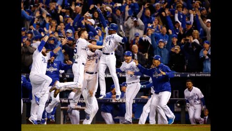 The Kansas City Royals celebrate their 5-4 win against the New York Mets after 14 innings in<a href="http://www.cnn.com/2015/10/27/us/world-series-mets-royals-game-1/index.html"> Game 1 of the World Series</a> at Kauffman Stadium in Kansas City, Missouri on Tuesday, October 27.