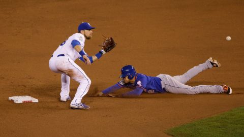 Mets center fielder Juan Lagares steals second base on a late throw to Ben Zobrist of the Royals.