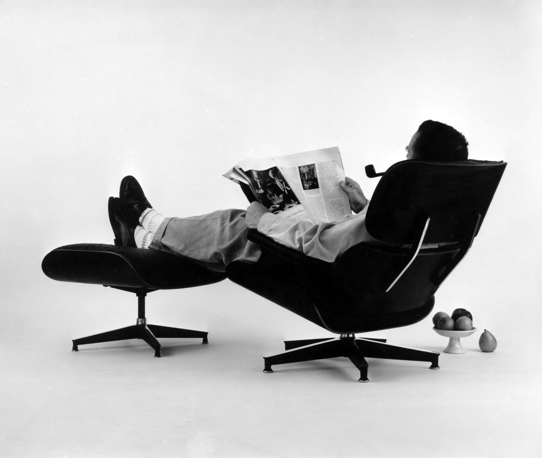 Charles Eames in the plywood Lounge and Ottoman. Photograph for an advertisement,1956
