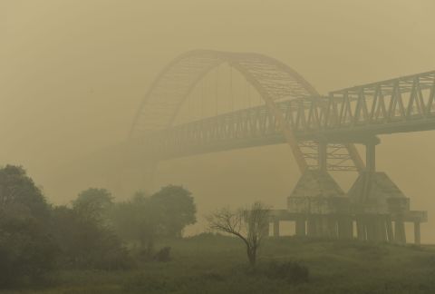 Kahayan Bridge is pictured through yellow, acrid haze in Palangkaraya on October 27, 2015.