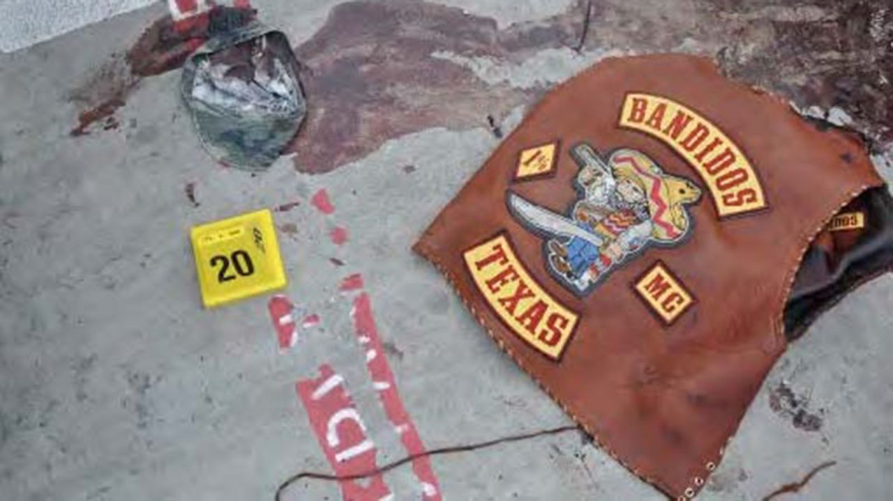 A Bandidos vest and hat are left behind in a pool of blood. The Bandidos boast a membership of 2,000 to 2,500 across not just the United States, but also 13 other countries, the Department of Justice says.