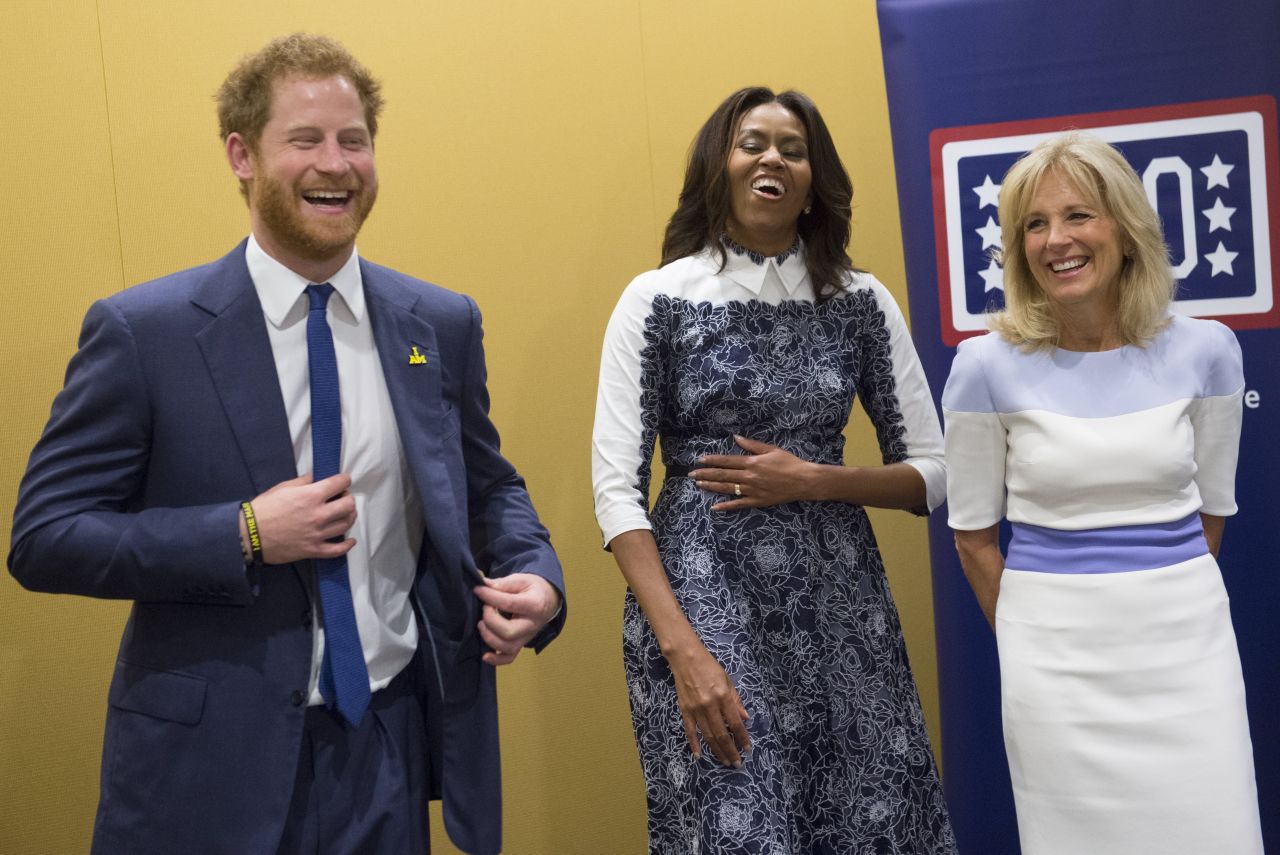 The prince, Obama and Biden laugh as they listen to a music presentation by wounded warriors at the center on October 28.