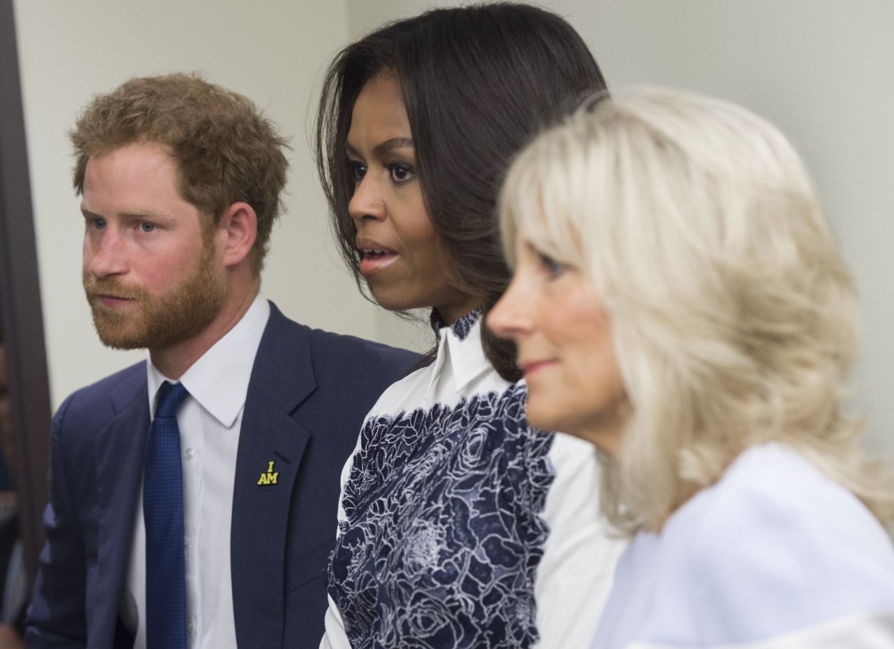 Harry, Obama and Biden tour the USO Warrior and Family Center on October 28.