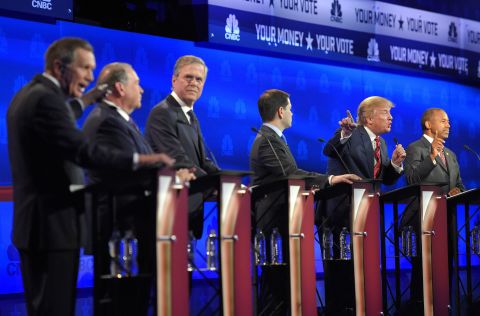 John Kasich, left, and Donald Trump argue across fellow candidates during the GOP debate at the University of Colorado in Boulder on Wednesday, October 28. Fourteen candidates participated in the third set of Republican presidential debates.