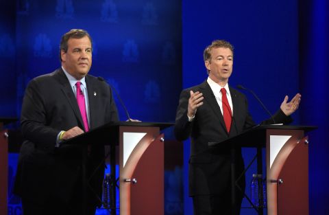 Rand Paul, right, speaks as Chris Christie looks on. Paul said, "If you're not willing to gradually raise the age, you're not serious about" fixing Social Security and Medicare. On the same topic, Christie hit the Democrats for making big promises. "When they say they want to give it to you free, keep your hand on your wallet," he said.