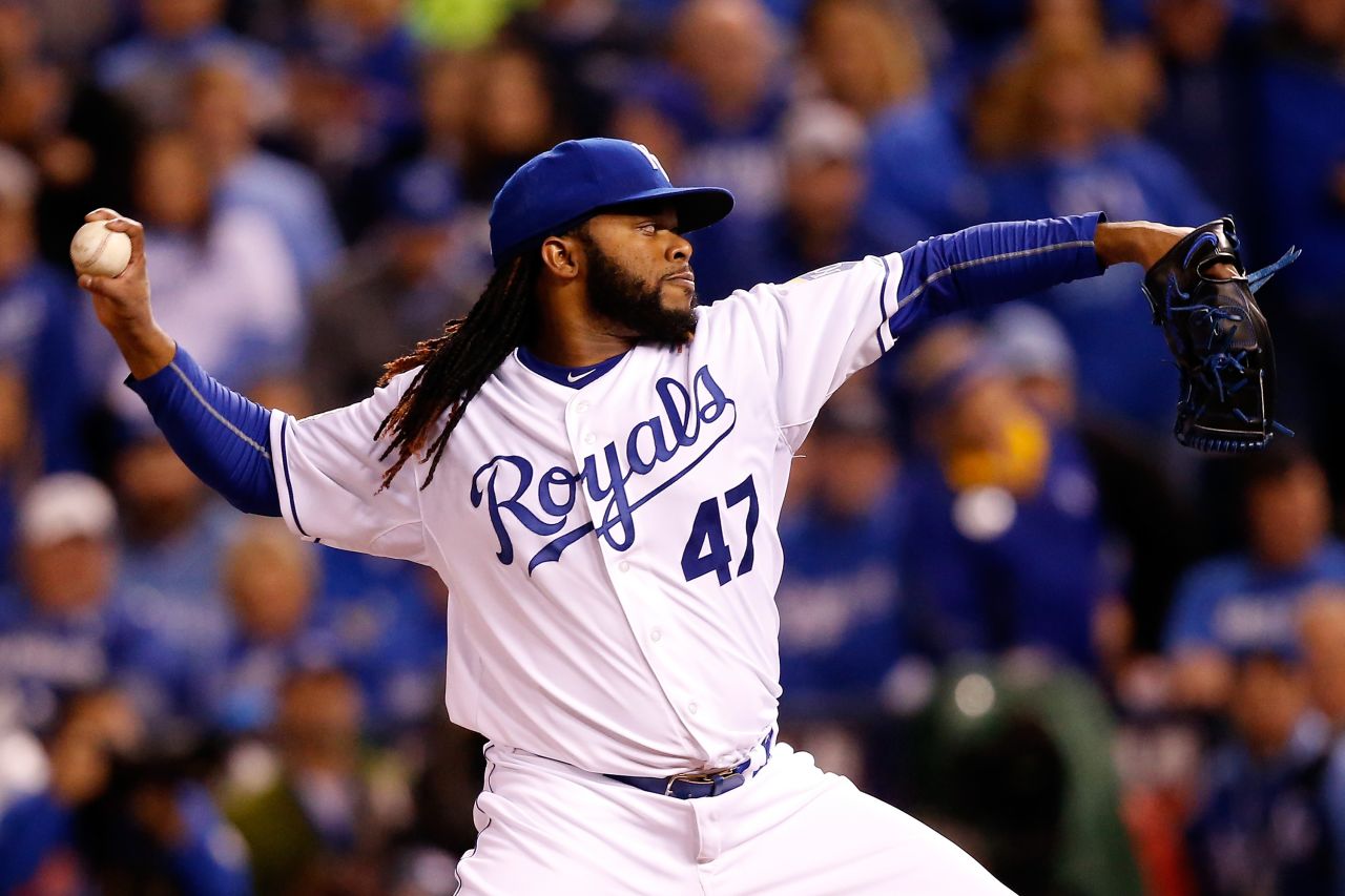 Johnny Cueto of the Royals throws a pitch in the first inning against the New York Mets.