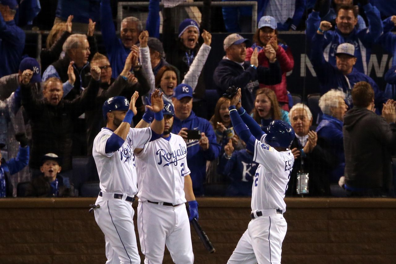 The Royals' Alex Rios, from left, Kendrys Morales and Alcides Escobar celebrate after scoring runs in the fifth inning.