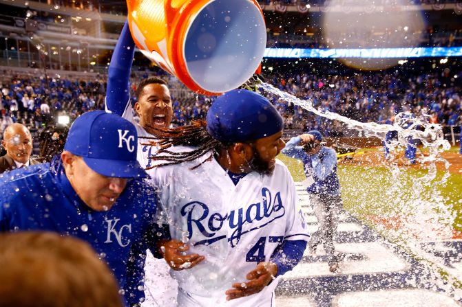 Salvador Perez of the Kansas City Royals douses Johnny Cueto after the team defeated the New York Mets 7-1 in <a href="index.php?page=&url=http%3A%2F%2Fwww.cnn.com%2F2015%2F10%2F28%2Fus%2Fworld-series-mets-royals-game-2%2Findex.html" target="_blank">Game 2 of the World Series</a> in Kansas City, Missouri, on Wednesday, October 28.