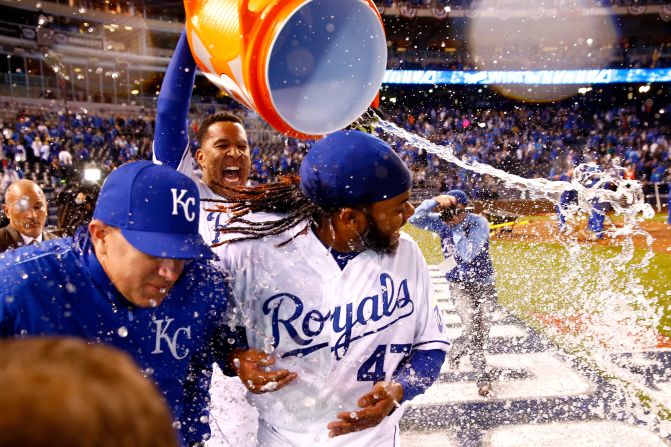 Salvador Perez of the Kansas City Royals douses Johnny Cueto after the team defeated the New York Mets 7-1 in <a href="http://www.cnn.com/2015/10/28/us/world-series-mets-royals-game-2/index.html" target="_blank">Game 2 of the World Series</a> in Kansas City, Missouri, on Wednesday, October 28.