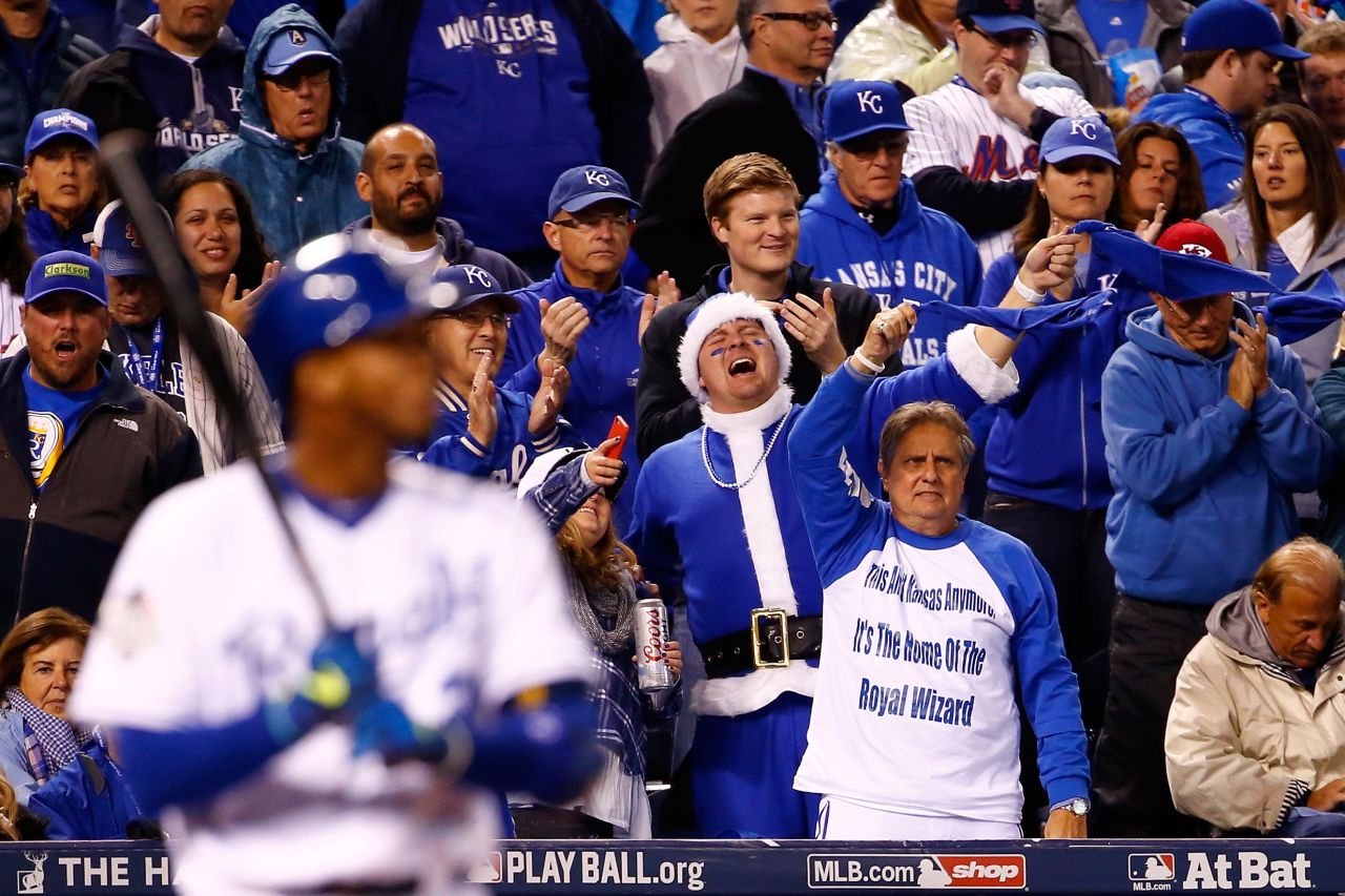 Kansas City Royals fans cheer as Alcides Escobar prepares to bat in the fifth inning.