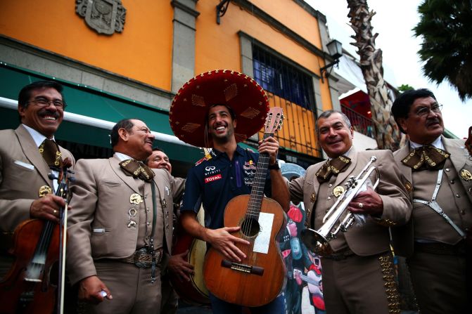 What can we expect from the return of the Mexican Grand Prix to the Formula One calendar after 23 years? Passionate fans are expected to be top of the Mexican menu. Here  Daniel Ricciardo of Australia and Infiniti Red Bull Racing poses with a mariachi band.