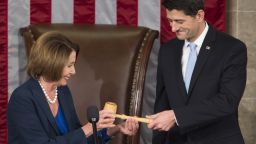 Newly elected Speaker of the House Paul Ryan, Republican of Wisconsin, receives the Speaker's gavel from House Democratic Leader Nancy Pelosi of California after becoming the new Speaker of the House in the House Chamber at the US Capitol in Washington, DC, October 29, 2015. AFP PHOTO / SAUL LOEB        (Photo credit should read SAUL LOEB/AFP/Getty Images)