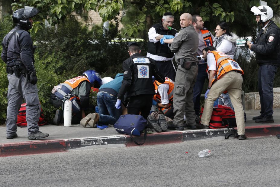 Israeli security forces and emergency personnel attend to an Israeli victim of a Palestinian stabbing attack in Jerusalem on October 30. A Palestinian stabbed two Israelis in Jerusalem before being shot, police and the army said, in the first knife attack in the city in two weeks. 