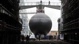 Workers prepare the launching ceremony of the Russian diesel-electric attack submarine Stary Oskol on Admiralty Shipyard in Saint Petersburg on August 28, 2014. Submarine "Stary Oskol" Project 636 is the third in the series, built to deliver the Russian Black Sea Fleet. Stary Oskol belongs to the Improved Kilo by NATO classification. AFP PHPOTO / OLGA MALTSEVA        (Photo credit should read OLGA MALTSEVA/AFP/Getty Images)