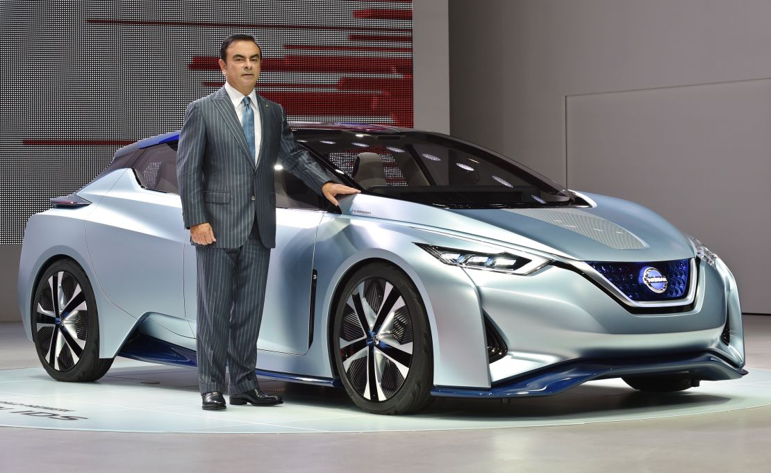 Nissan CEO Carlos Ghosn stands next to the manufacturer's IDS Concept, which drove onto the stage by itself.