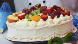 Named after one of the world's most famous ballerinas, the Pavlova cake is served beautifully overflowing with summer fruits heaped on top.