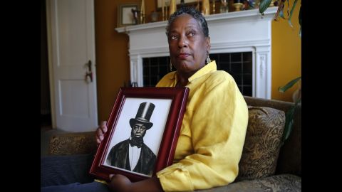 Ocea Thomas of Atlanta, here with a picture of her ancestor, Samuel D. Burris, helped write letters in support of a pardon for Burris. Delaware Gov. Jack Markell on Monday, November 2, pardoned Burris, a free black man and conductor on the Underground Railroad who died in 1863. Burris was convicted of helping slaves escape to freedom in the 1840s.