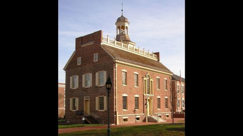 The pardon was issued at the Old State House in Dover, which served many purposes. This is where Samuel D. Burris was tried and convicted. He was auctioned on the building's marble steps (which have been replaced).