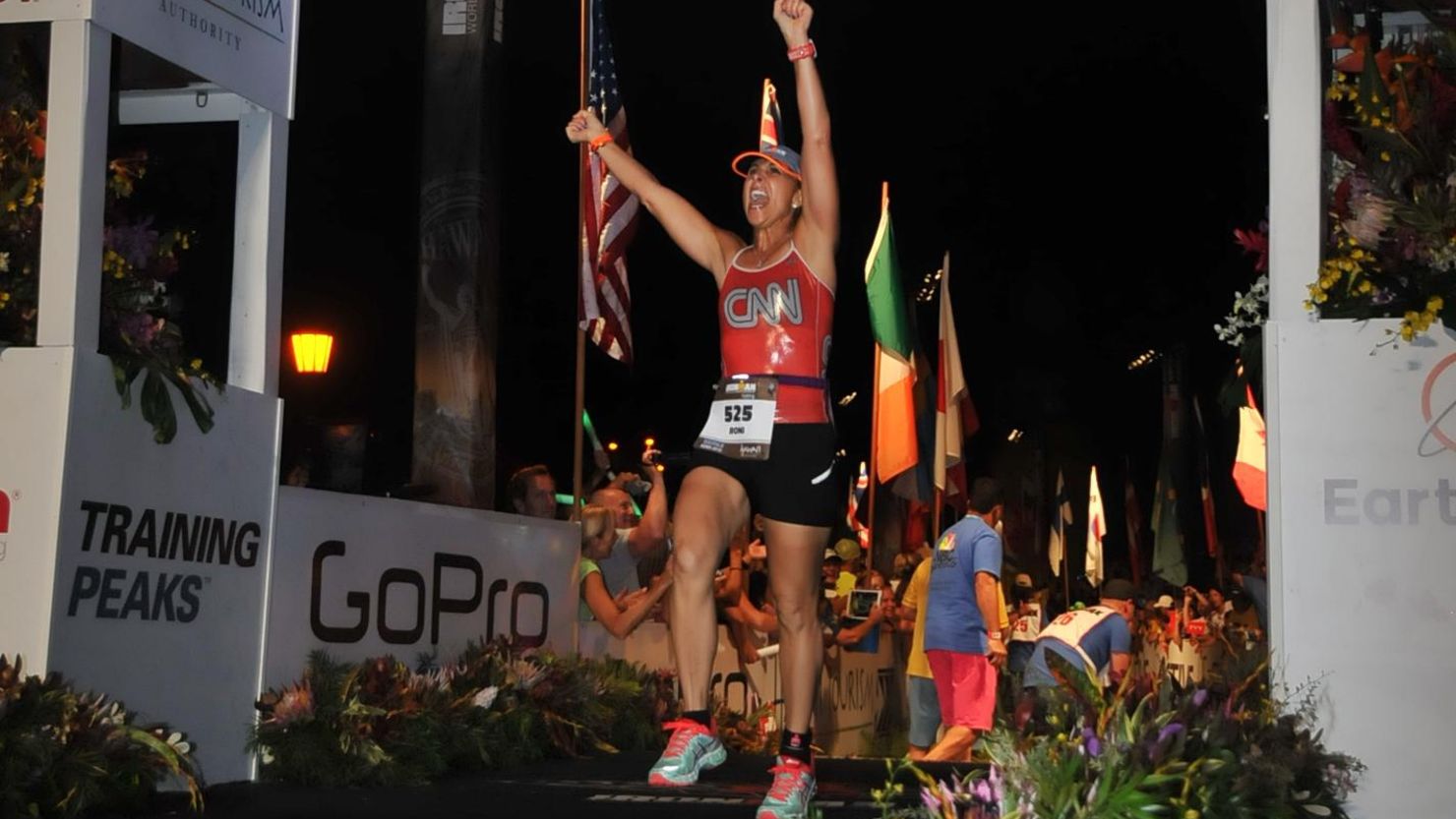Roni Selig crosses the finish line of the Ironman World Championship in Kona, Hawaii. 