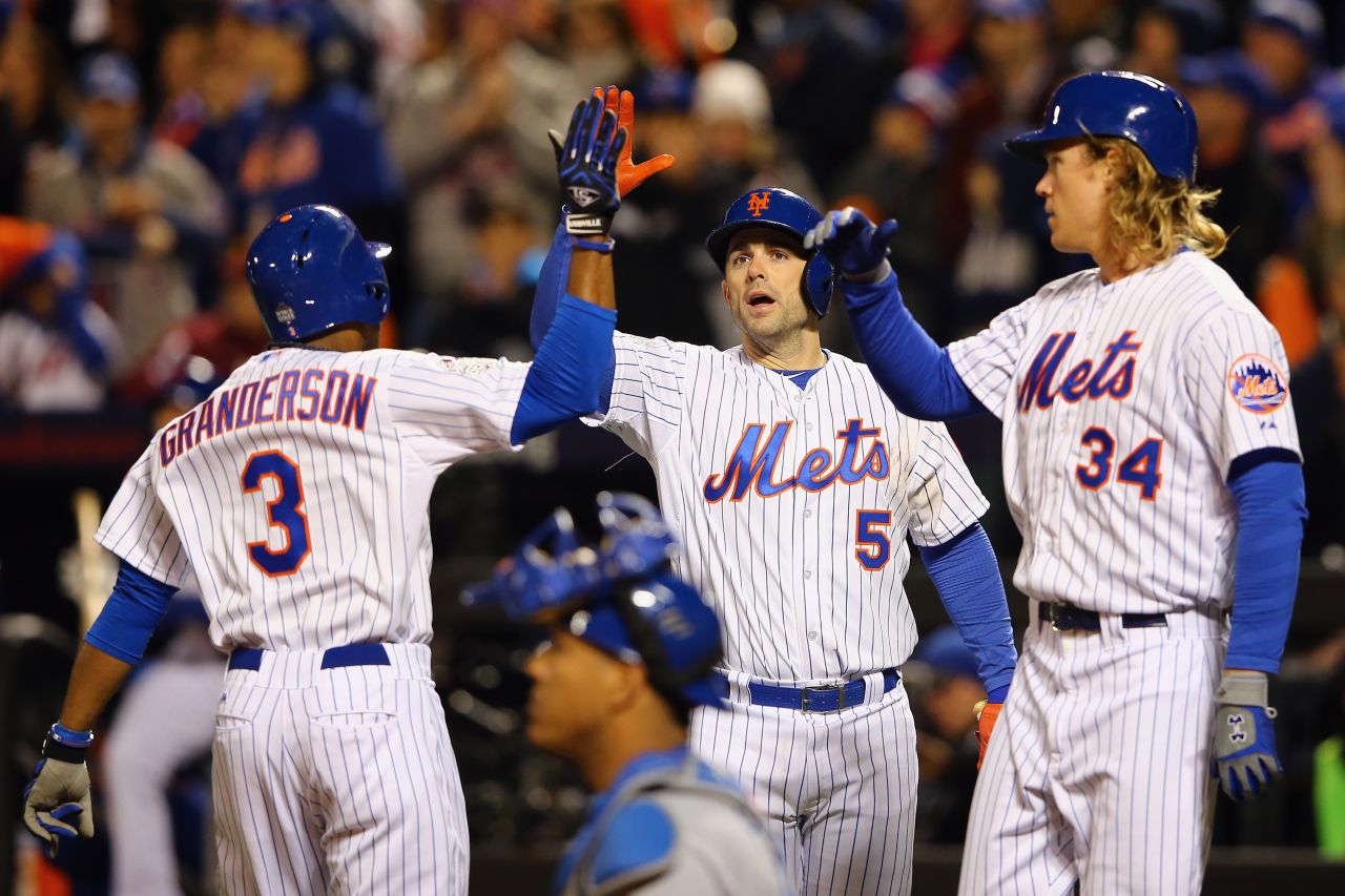 New York Mets Curtis Granderson, from left, celebrates with David Wright and Noah Syndergaard after hitting a two-run home run.
