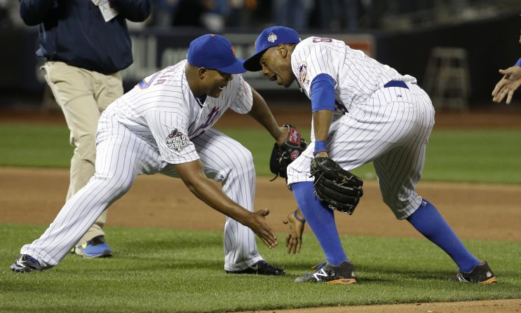 The Mets' Jeurys Familia and Curtis Granderson celebrate after beating the Royals in Game 3 in New York on Friday, October 30.