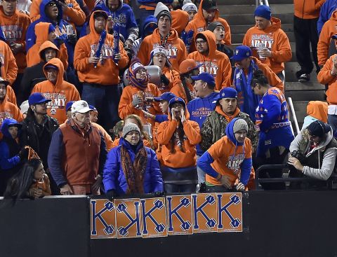 New York Mets fans keep track of strikeouts by Mets starting pitcher Noah Syndergaard against the Royals.