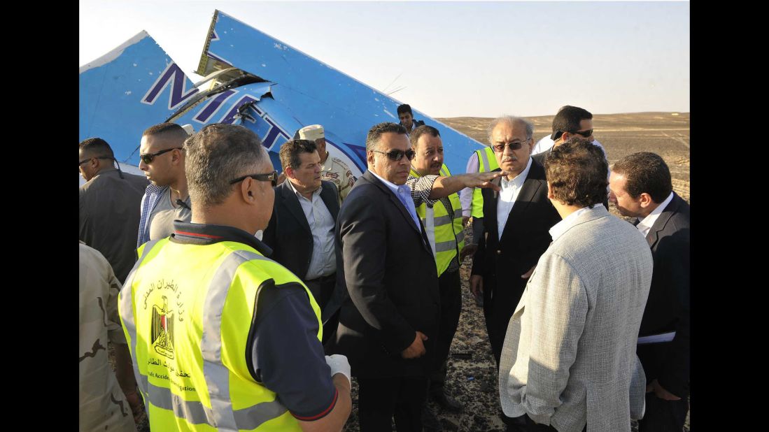 Egyptian Prime Minister Sherif Ismail, third from right, visits the site of the plane crash with military and government officials on October 31.
