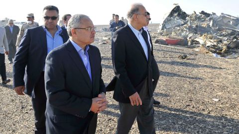 Ismail, center, and other officials visit the site of the plane crash on October 31.
