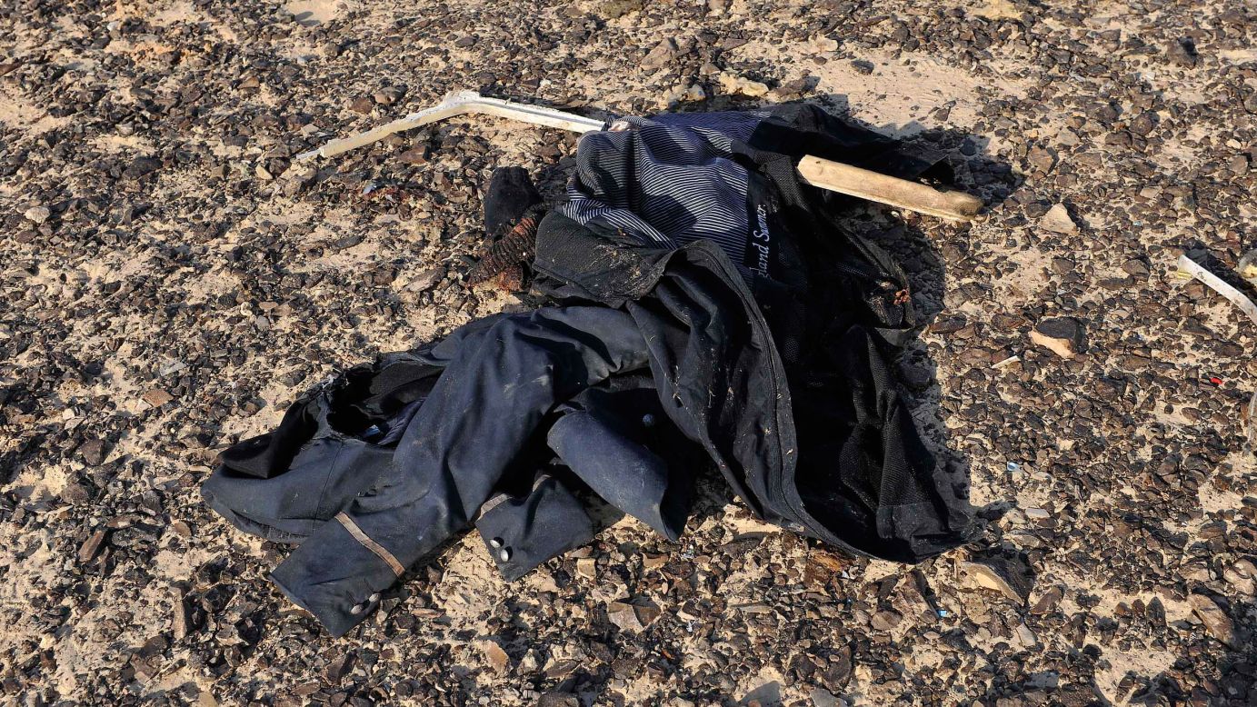 An item of clothing lies at the site where the plane crashed on October 31.