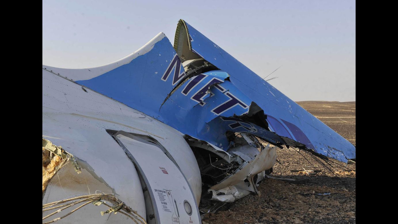 The tail of the jet sits in a field on October 31. 
