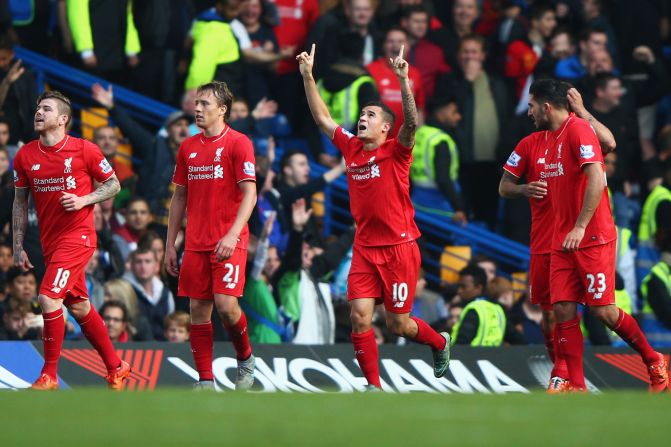 Philippe Coutinho signals his delight after scoring his second goal in the 3-1 win for Liverpool at Chelsea.