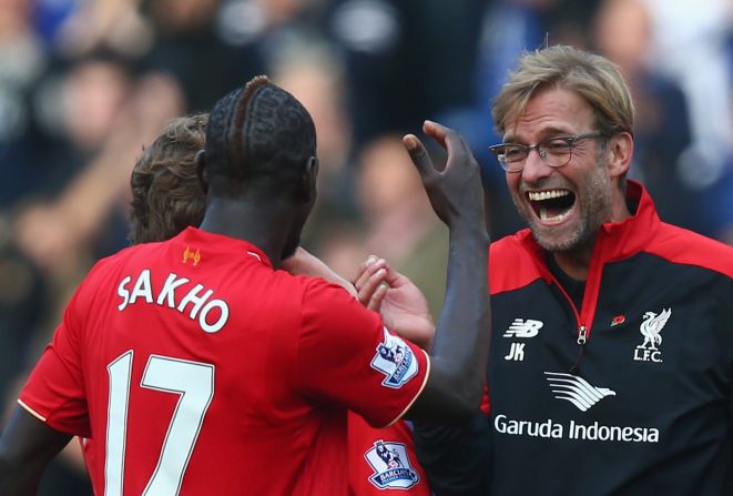 A delighted Klopp celebrates his team's win at Stamford Bridge with Mamadou Sakho.