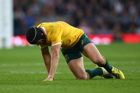 Matt Giteau of Australia made a sorry first half exit for the Wallabies after picking up an injury. 