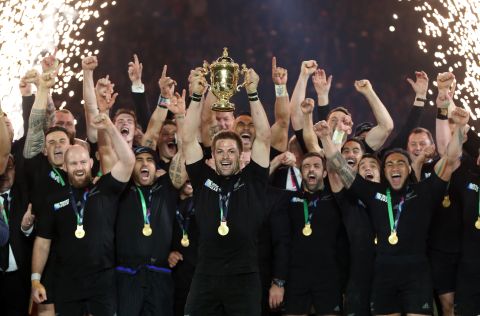 Richie McCaw lifts the Webb Ellis Cup as New Zealand retains the Rugby World Cup following a 34-17 victory over Australia at Twickenham. 