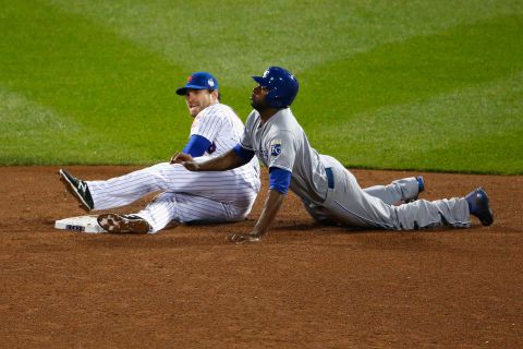 Lorenzo Cain of the Royals slides safely into second base in front of Daniel Murphy of the Mets in the sixth inning.