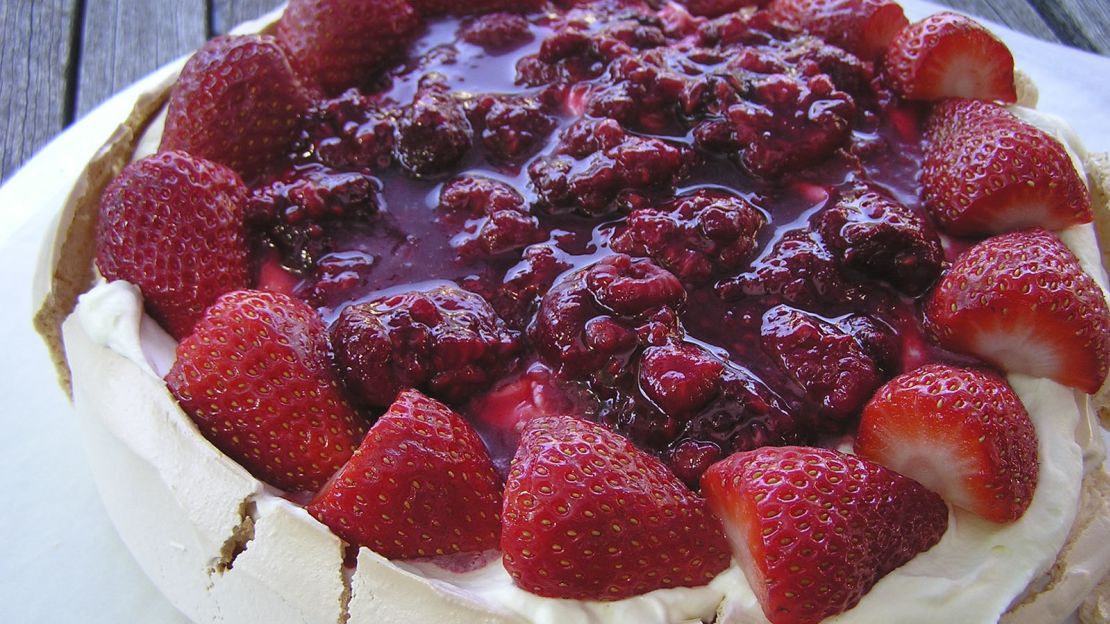 Pavlova is usually topped with summer fruits.