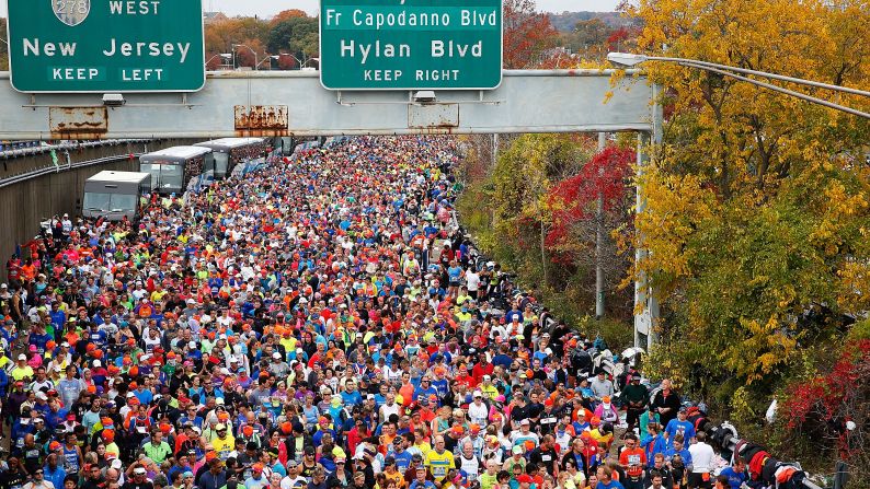 Runners wait at <a href="index.php?page=&url=http%3A%2F%2Fbleacherreport.com%2Farticles%2F2584896-new-york-marathon-results-2015-mens-and-womens-top-finishers%3Futm_source%3Dcnn.com%26utm_medium%3Dreferral%26utm_campaign%3Deditorial" target="_blank" target="_blank">the starting line</a> prior to crossing the Verrazano-Narrows Bridge.