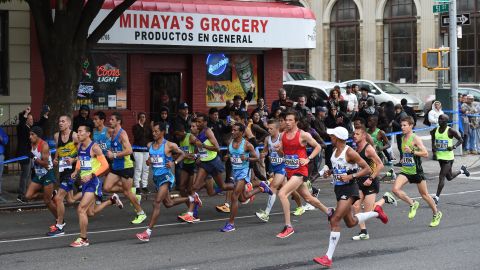 Elite runners make their way through the streets of Brooklyn during the marathon.