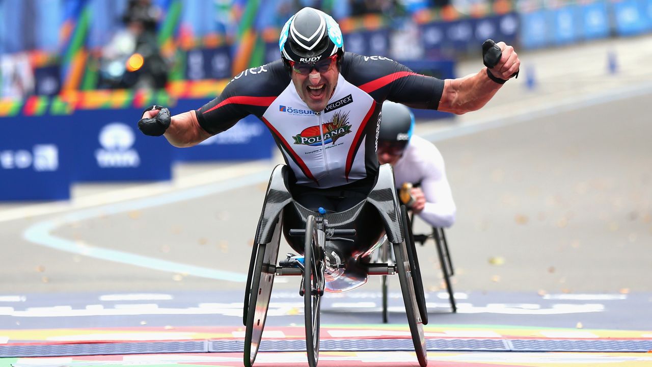 Ernst van Dyk of South Africa celebrates as he crosses the finish line to win the Men's Professional Wheelchair Division.