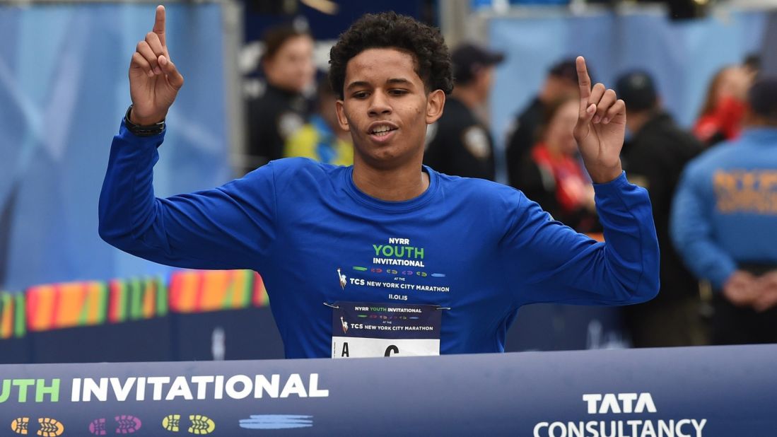 Matthew Nieves, 16, from New York's Bishop Loughlin High School, crosses the finish line to win the inaugural New York Road Runners Youth Invitational event of the marathon.