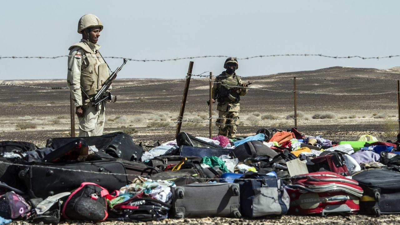 Egyptian army soldiers guard the luggage and other belongings of passengers piled up at the site of the crash on November 1.