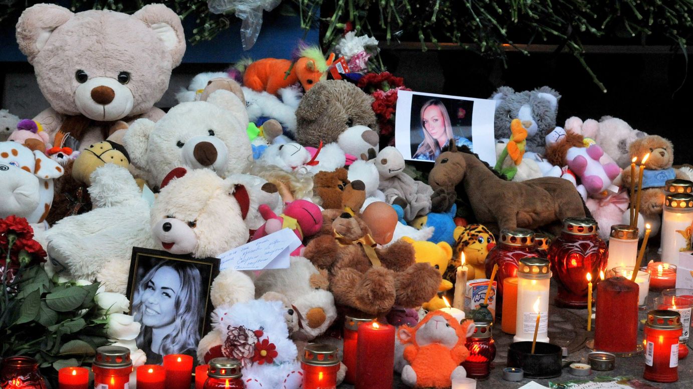 Candles, toys, flowers and portraits are left at Pulkovo International Airport outside St. Petersburg on November 1.